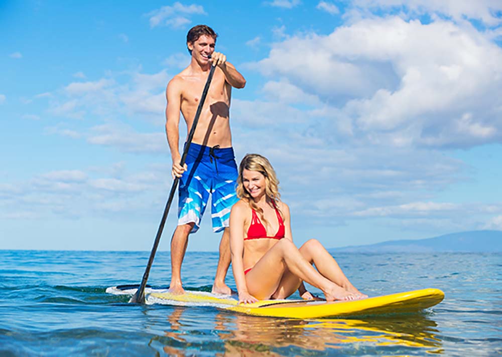 couple-paddle-boarding-in-maui-one-board-one-scale